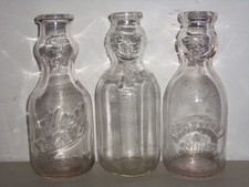 3 - QT Cream Baby Face Cop Top Ebossed Milk Bottles picture