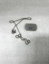 Vintage NIKE dog tag specifically a promo item from flagship 