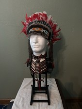 traditional-style. Plains Indian war bonnets and bone hairpipe breastplates picture