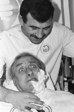 Comedian Spike Milligan has his beard shaved using a blade from Wi- Old Photo picture