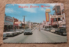 Nogales Sonora Mexico 1960's Postcard Obregan Ave Shops Sosa's Mercado Liquor picture