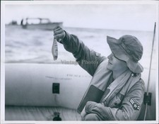 1956 Man In Raft Holding Up Small Fish Smiling Wearing Hat Vintage Photo 6x8 picture