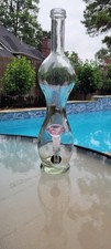 Bulbous Glass Bottle Repurposed Into a Bong.  Large picture