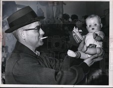 1960 Press Photo Burt Watkens of Cleveland Ohio with a doll baby - net17467 picture