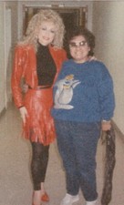 Fan Encounter with Dolly Parton Striking Red Outfit Capturing Iconic Moment picture