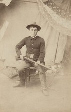 c. 1870's American Soldier Seated with Rifle, Star Banner in Back Photograph picture