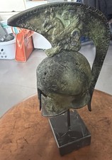Helmet with winged figure Ancient Greek marble based helmet artifact picture