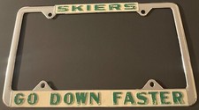Vintage Skiers Go Down Faster Booster License Plate Frame Skier Skiing METAL picture