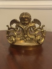 vintage ornate brass candle holder, winged cherub, Rococo-style scrollwork picture