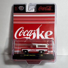 Coca-Cola 1973 GMC Jimmy Sierra Surf Board M2 Machines 1:64 Diecast Red/WhiteA66 picture