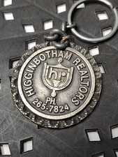 Old Vintage Heavy Metal Higginbotham Realtors Keychain picture