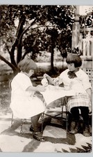 TWO LITTLE GIRLS TEA PARTY 1910s postcard real photo rppc home family home picture