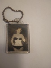 This is a Vintage Keychain with a movable, dancing, photo picture