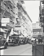 Automobiles line the narrow streets of Chinatown in Manhattan 1934 Old Photo picture