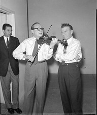 US comedian actor Jack Benny plays his trademark violin while come- Old Photo picture