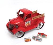 Antiqued Red Farm Truck With Seasonal Magnet Signs picture