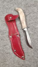 Vintage small hunting knife in a leather sheath with Indian picture