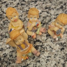 Set of 4 Baby Figurines Porcelain Multicolor Matte Finish Unboxed picture