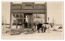 Vintage RPPC Winter Scene Horse Drawn Sleigh Men Brick Storefront Postcard picture
