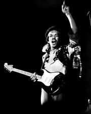 Jimi Hendrix gets into the mood on stage holding guitar 24x30 Poster picture