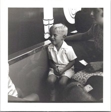 Young Blonde Boy Seated on Theme Park Ride, 1960s B&W Snapshot Photo picture