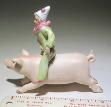 Vintage bisque clown riding pig figure picture