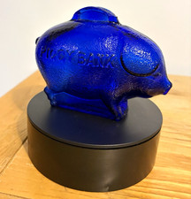This is a vintage cobalt blue textured glass piggy bank. picture