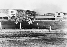 Rex Mays and his racecar fly through the air upside-down as his ve- Old Photo picture
