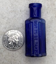 A MINIATURE ANTIQUE BLUE GLASS HEXAGONAL RIBBED POISON BOTTLE “NOT TO BE TAKEN” picture