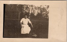 Postcard Real Photo RPPC Woman Sitting in Chair in Yard Unposted picture