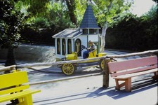 c1960's Kodachrome 35mm Slide, Boy Driving Yellow Car Ride Building green Roof picture
