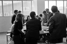 Young university students discussing a class room a student assemb- Old Photo picture