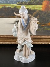 Vintage Oriental Fisherman Figurine picture