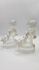 Vintage Clear Glass Girl Holding Goose Figurine Pair Hollow Base Insulator Style picture