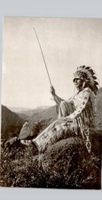 FULL HEADRESS INDIAN ON HILL c1940 postcard (trimmed) real photo rppc native picture