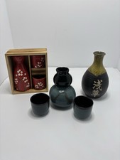 7 Pc Ceramic 3 Sake bottle’s 2 sets complete and one bottle no cups. picture