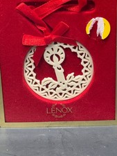 Lenox round white ornament with red ribbon picture