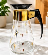 VTG CORNING WARE COFFEE CARAFE.  GOLD ATOMIC STARBURST PATTERN.  6 CUP. 8” TALL picture