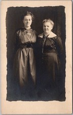 c1910s Studio Photo RPPC Postcard 2 Ladies in Black Dresses / Black Background picture