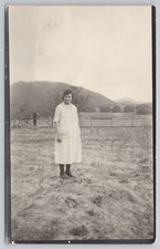 Postcard Vintage RPPC Woman Standing in a Field Farm picture