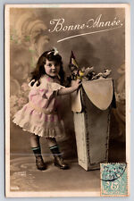 Vintage Postcard French Girl Opening A Large Box of Toys: Dolls, Rocking Horse picture