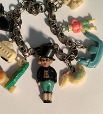 Rare ADORABLE Doll Accompanied By Fun CELLULOID Cracker Jack CHARM BRACELET picture