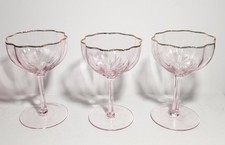 Set of three pink coupe glasses with gold trim and fluted bowls picture