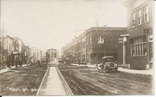 Vintage 1920s Era RPPC Main Street Scene Spooner WI Wisconsin Postcard Trolley picture