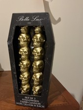 of two Bella Lux Gold Halloween Stacked Skulls Taper Candles, measuring 10 inche picture