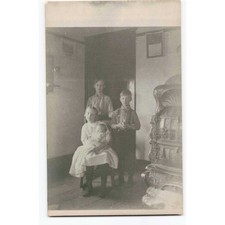 RPPC 1920 Bullock Family Four Children Ornate Parlor Stove Real Photo Postcard picture