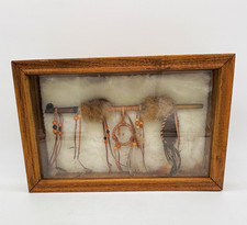 Native American peace pipe with a small dreamcatcher in a wooden shadow box picture