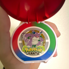 PokéPark KANTO Nidoking Pin Badge with Poké Ball Case Multicolor Metal picture