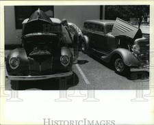 1990 Press Photo Gregg Kirk, Summerfield, La., admires cars at Slidell Car Show picture