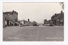 Main Street Hartley Iowa Coca Cola Rexall Drugstore Storefronts Old Cars RPPC picture